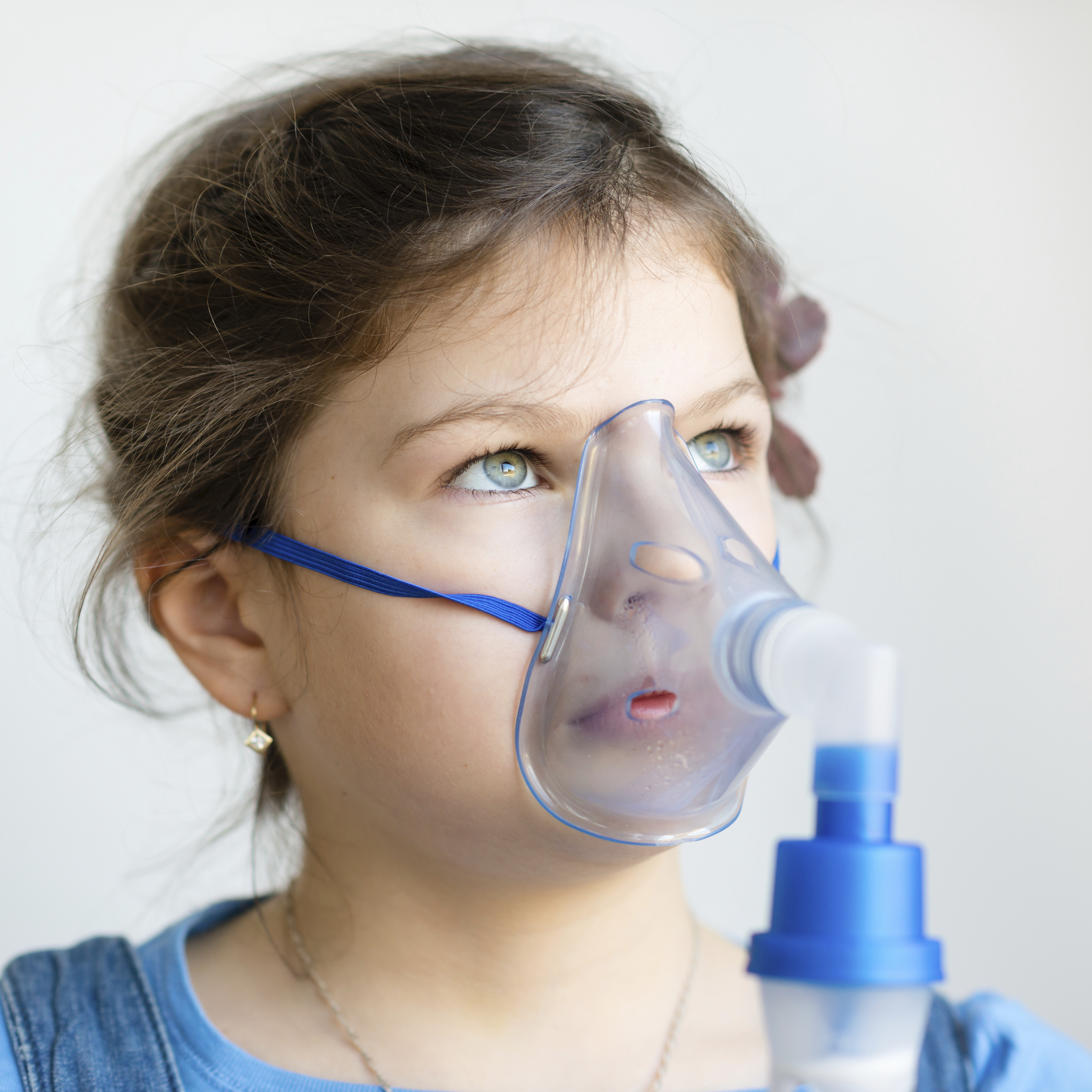 girl with asthma inhaler