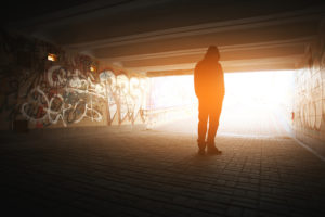 Man in tunnel, facing addiction