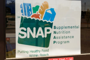 A Sign at a Retailer - We Accept SNAP