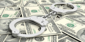 Handcuffs on dollar banknotes