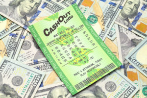 Winning Lottery Ticket with Pile of Money Isolated