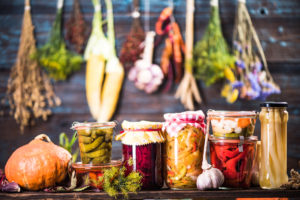 Pickled Marinated Fermented vegetables on shelves in cellar