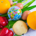 vegetables and fruit with a globe