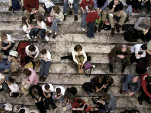 Woman Alone in a Large Crowd